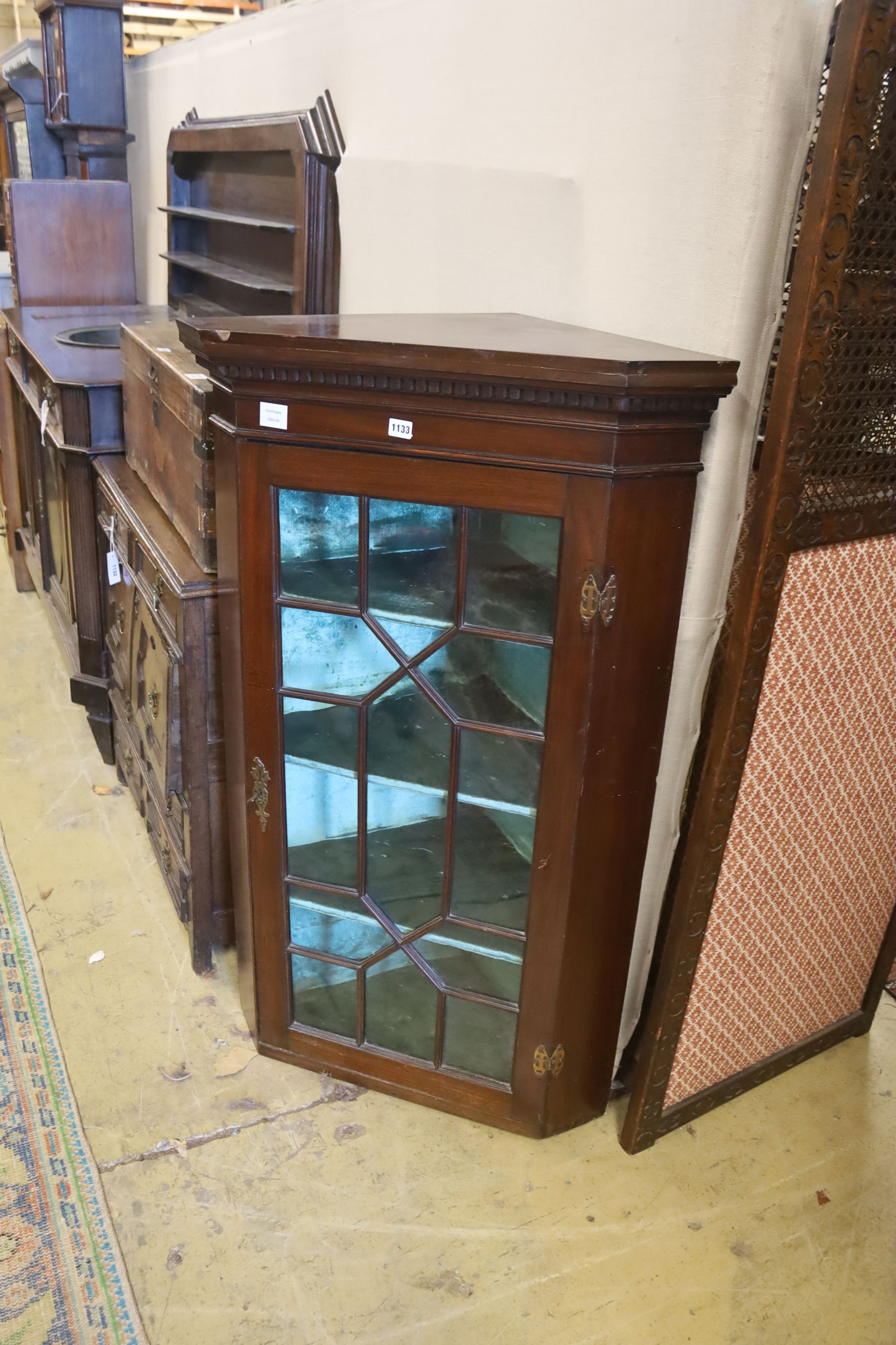 A George III and later mahogany astragal glazed hanging corner cabinet, width 77cm, depth 50cm, height 126cm